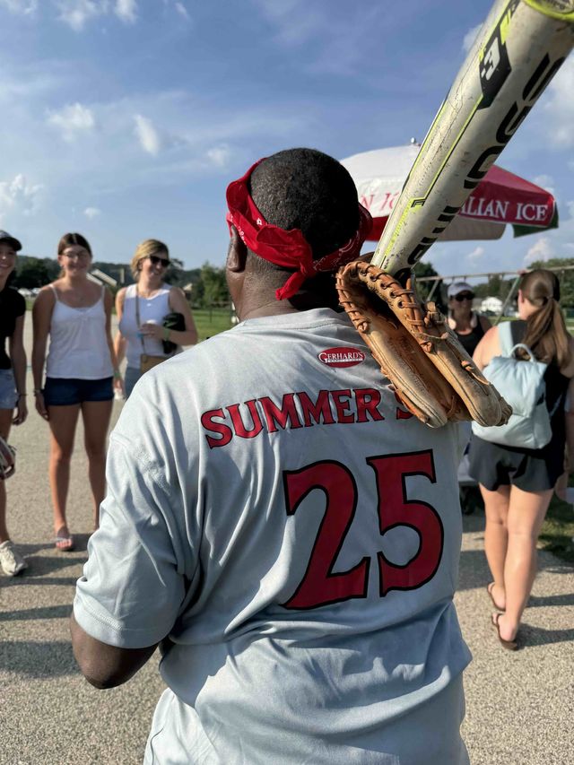 View of a man from behind wearing a Gerhard's softball jersey with Summer 25 on the back.